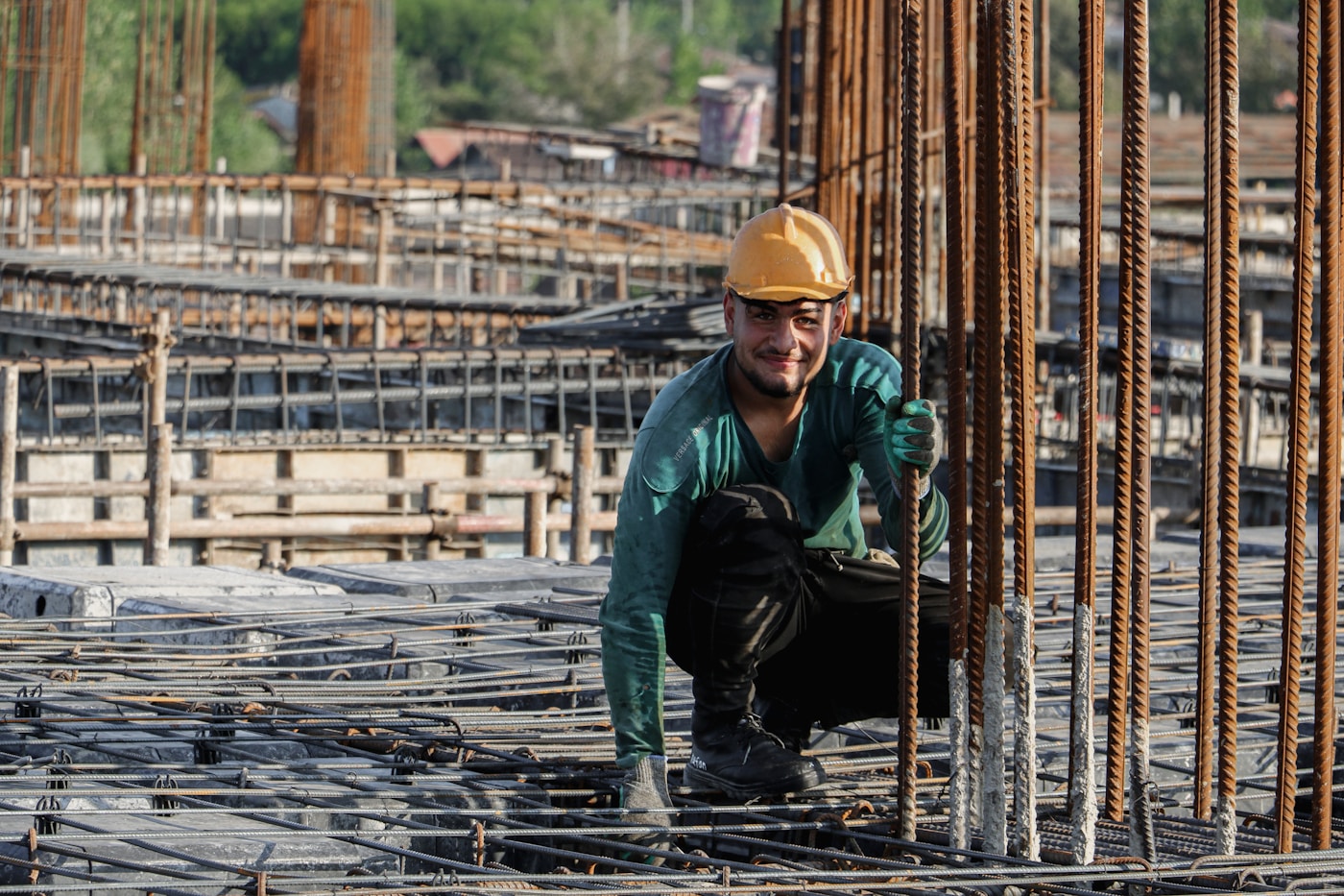 A construction worker on site smiling